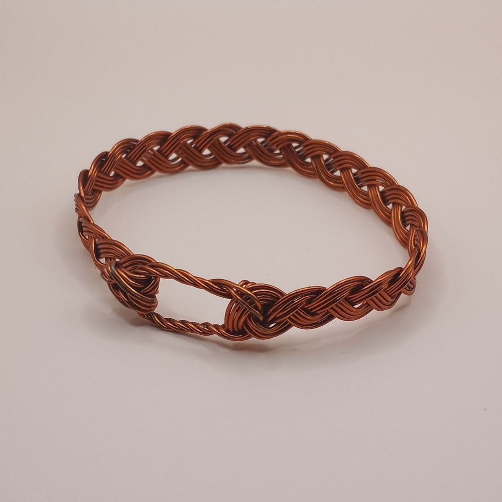 ORANGE BRAIDED METAL BRACELET